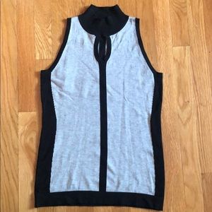 Sleeveless mock turtleneck with keyhole cutout.😘